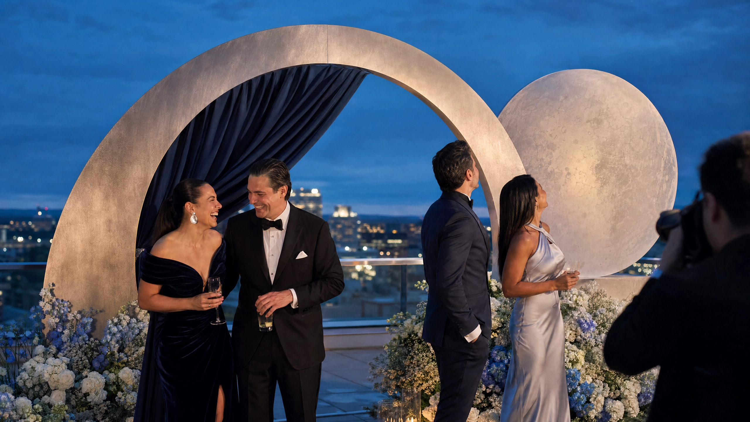 The evening's first photo opportunity unfolds beneath a glowing full moon installation.