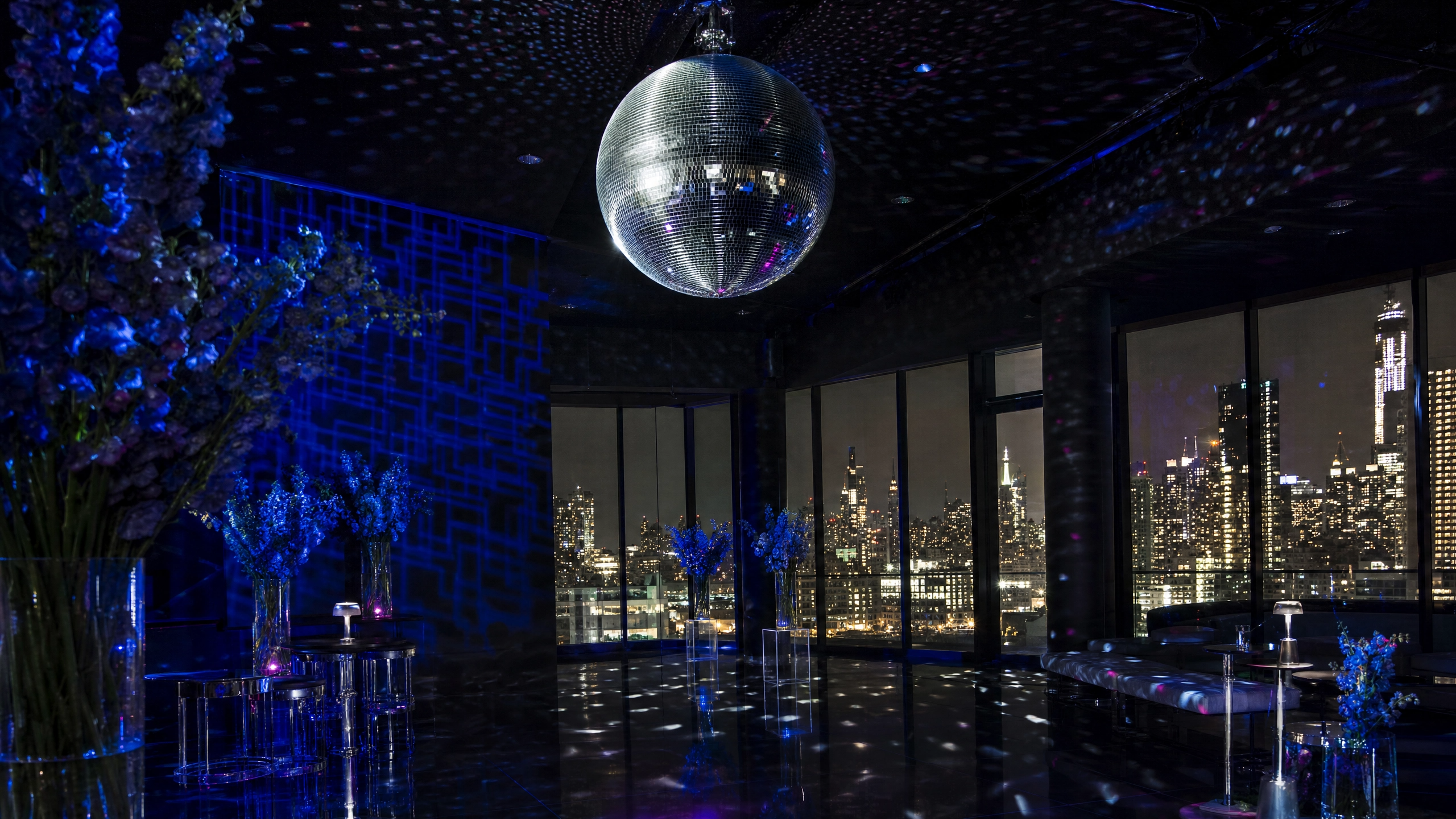 The mirror ball is suspended above the dance floor, marking the evening's transition.